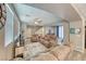 Bright living room with neutral decor, a ceiling fan, and views into adjacent living spaces at 5428 Brazelton St, North Las Vegas, NV 89081