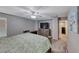 Comfortable bedroom featuring carpeted floors, ceiling fan, and a wall mounted television at 5428 Brazelton St, North Las Vegas, NV 89081