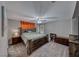 Spacious Primary bedroom with king-size bed and media console at 5428 Brazelton St, North Las Vegas, NV 89081