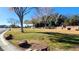 Community park with grassy area, trees, and picnic table at 5633 Bridgehampton Ave, Las Vegas, NV 89130