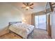 Bedroom with neutral walls, slider door access, and ceiling fan at 5655 Vineyard Ln # 0, Las Vegas, NV 89110