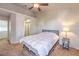 Bedroom featuring neutral paint, soft carpet, ceiling fan, and modern furnishings at 5655 Vineyard Ln # 0, Las Vegas, NV 89110