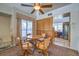 Bright dining area with a ceiling fan, large window, and seating for four at 5655 Vineyard Ln # 0, Las Vegas, NV 89110