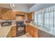 Functional kitchen with stainless steel refrigerator and plenty of cabinet space at 5655 Vineyard Ln # 0, Las Vegas, NV 89110