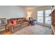 Living room featuring neutral paint, sliding glass door access, and lots of seating at 5655 Vineyard Ln # 0, Las Vegas, NV 89110