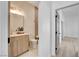 Bathroom with light wood vanity and a bathtub at 5737 Heather Breeze Ct, Las Vegas, NV 89141