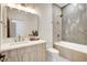 Modern bathroom with herringbone tile and a soaking tub at 5737 Heather Breeze Ct, Las Vegas, NV 89141