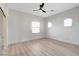 Bright bedroom with wood-look floors and arched windows at 5737 Heather Breeze Ct, Las Vegas, NV 89141