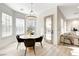 Bright dining area with round table and chairs, near kitchen at 5737 Heather Breeze Ct, Las Vegas, NV 89141