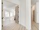 Bright hallway with light hardwood floors and neutral walls at 5737 Heather Breeze Ct, Las Vegas, NV 89141