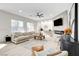 Modern living room with sectional sofa and fireplace at 5737 Heather Breeze Ct, Las Vegas, NV 89141