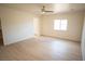 Bright bedroom with ample space, neutral walls, and light wood flooring throughout at 5821 Genoa Ave, Pahrump, NV 89060