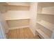 Walk-in closet with shelving providing ample storage space at 5821 Genoa Ave, Pahrump, NV 89060