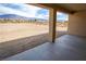 Inviting covered patio with scenic views of the landscape and distant mountains at 5821 Genoa Ave, Pahrump, NV 89060