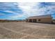 Desert house on a large lot, with mountains in the background at 5821 Genoa Ave, Pahrump, NV 89060