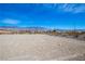 Sprawling lot with a mountain view on a sunny day at 5821 Genoa Ave, Pahrump, NV 89060