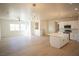 Open concept living space with kitchen island and modern light fixtures at 5821 Genoa Ave, Pahrump, NV 89060