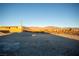 Empty lot with mountain views and gravel ground at 5821 Genoa Ave, Pahrump, NV 89060