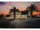 Stunning curb appeal with a two-car garage and palm trees at 602 Calcutta Ln, Henderson, NV 89015