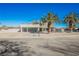 Two-story home with a modern facade and palm trees at 602 Calcutta Ln, Henderson, NV 89015