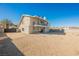 Modern two-story house with a balcony and desert landscaping at 602 Calcutta Ln, Henderson, NV 89015