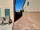 Small backyard with gravel and two chairs at 6059 Thistle Meadow Ave, Las Vegas, NV 89139