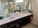 Bathroom with double vanity and large mirror at 6059 Thistle Meadow Ave, Las Vegas, NV 89139