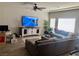 Large living room with sectional sofa and large TV at 6059 Thistle Meadow Ave, Las Vegas, NV 89139