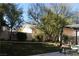 Landscaped backyard with a pergola and grassy area at 6113 Breeders Cup St, Las Vegas, NV 89130