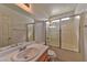 Bathroom with tub and shower combo and a well-lit mirror vanity at 6113 Breeders Cup St, Las Vegas, NV 89130