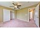 Spacious bedroom with ceiling fan, closet, and neutral paint provides a cozy atmosphere at 6113 Breeders Cup St, Las Vegas, NV 89130