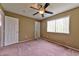 Neutral bedroom with ceiling fan, closet, and window for ample light at 6113 Breeders Cup St, Las Vegas, NV 89130