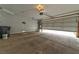 Spacious garage with an automatic door and ample space for parking and storage at 6113 Breeders Cup St, Las Vegas, NV 89130