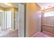 Second floor hallway with doors to rooms and stairs to lower level at 6113 Breeders Cup St, Las Vegas, NV 89130