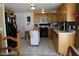 Kitchen features light wood cabinets and an island at 6113 Breeders Cup St, Las Vegas, NV 89130