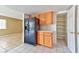 Wooden cabinets with black refrigerator and a pantry visible near the kitchen at 6113 Breeders Cup St, Las Vegas, NV 89130