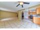 Open floor plan featuring tile flooring connecting the living room with the kitchen at 6113 Breeders Cup St, Las Vegas, NV 89130