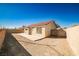 Spacious backyard with a large concrete patio and block wall at 6230 Home Haven St, North Las Vegas, NV 89031