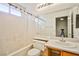 Neat bathroom with a shower/tub combo and mirror at 6230 Home Haven St, North Las Vegas, NV 89031