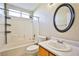 Clean bathroom with a shower/tub combo and updated vanity at 6230 Home Haven St, North Las Vegas, NV 89031