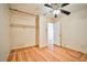 Bedroom with a spacious closet and light wood laminate flooring at 6230 Home Haven St, North Las Vegas, NV 89031