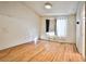 Light and bright bedroom with laminate wood flooring and a large window at 6230 Home Haven St, North Las Vegas, NV 89031