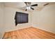 Spacious bedroom with hardwood floors and a ceiling fan at 6230 Home Haven St, North Las Vegas, NV 89031