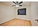 Well-lit bedroom with hardwood floors and a ceiling fan at 6230 Home Haven St, North Las Vegas, NV 89031