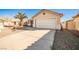 House exterior with driveway and desert plants at 6230 Home Haven St, North Las Vegas, NV 89031