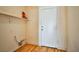 Functional laundry room with built-in shelving at 6230 Home Haven St, North Las Vegas, NV 89031