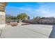 Large backyard with a concrete patio, gravel landscaping, and block wall at 6233 Morning Splendor Way, Las Vegas, NV 89110