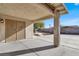 Spacious backyard with a large concrete patio and a covered area at 6233 Morning Splendor Way, Las Vegas, NV 89110