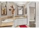 Bathroom with double sinks, granite countertop and a mirror at 6233 Morning Splendor Way, Las Vegas, NV 89110