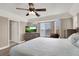 Main bedroom with bay window and ceiling fan at 6233 Morning Splendor Way, Las Vegas, NV 89110